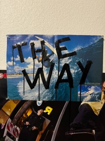 The Way poster, hand-lettered over a surf spread, taped to a dorm wall